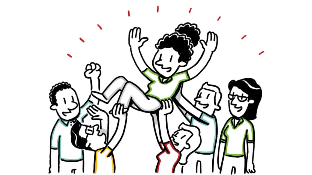 Team celebrating while lifting a colleague, symbolizing TruScribe’s guided process that makes professional whiteboard videos easy and aligned with your goals.