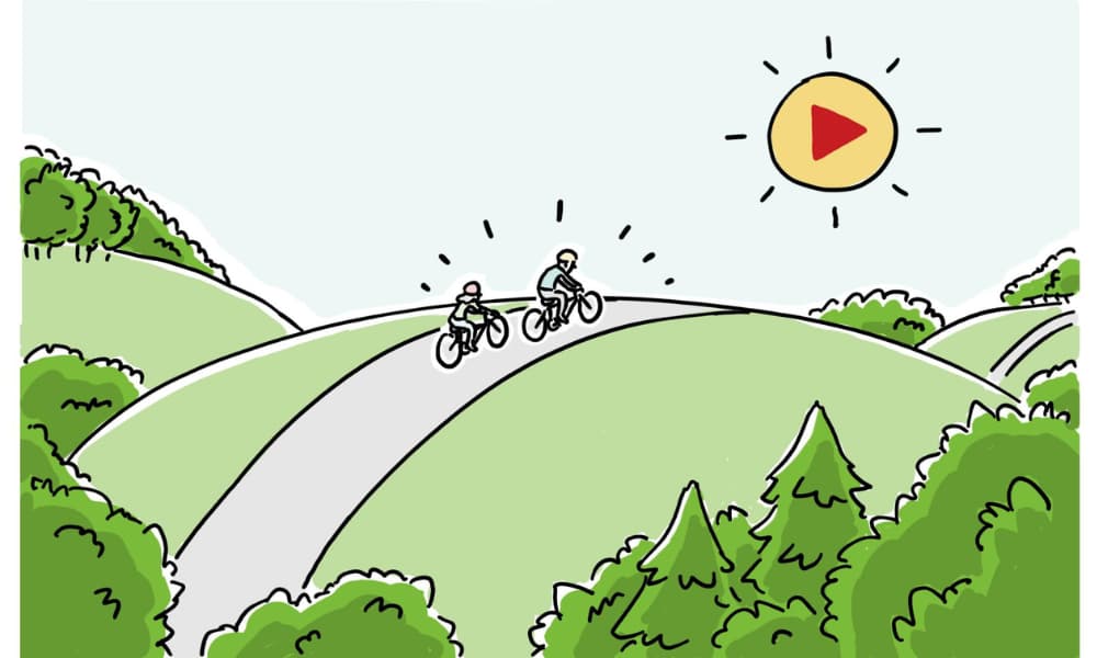 Two cyclists ride on a winding path through a green landscape, with the sun shining and a play button symbol in the sky, symbolizing the journey toward clear and engaging messaging.